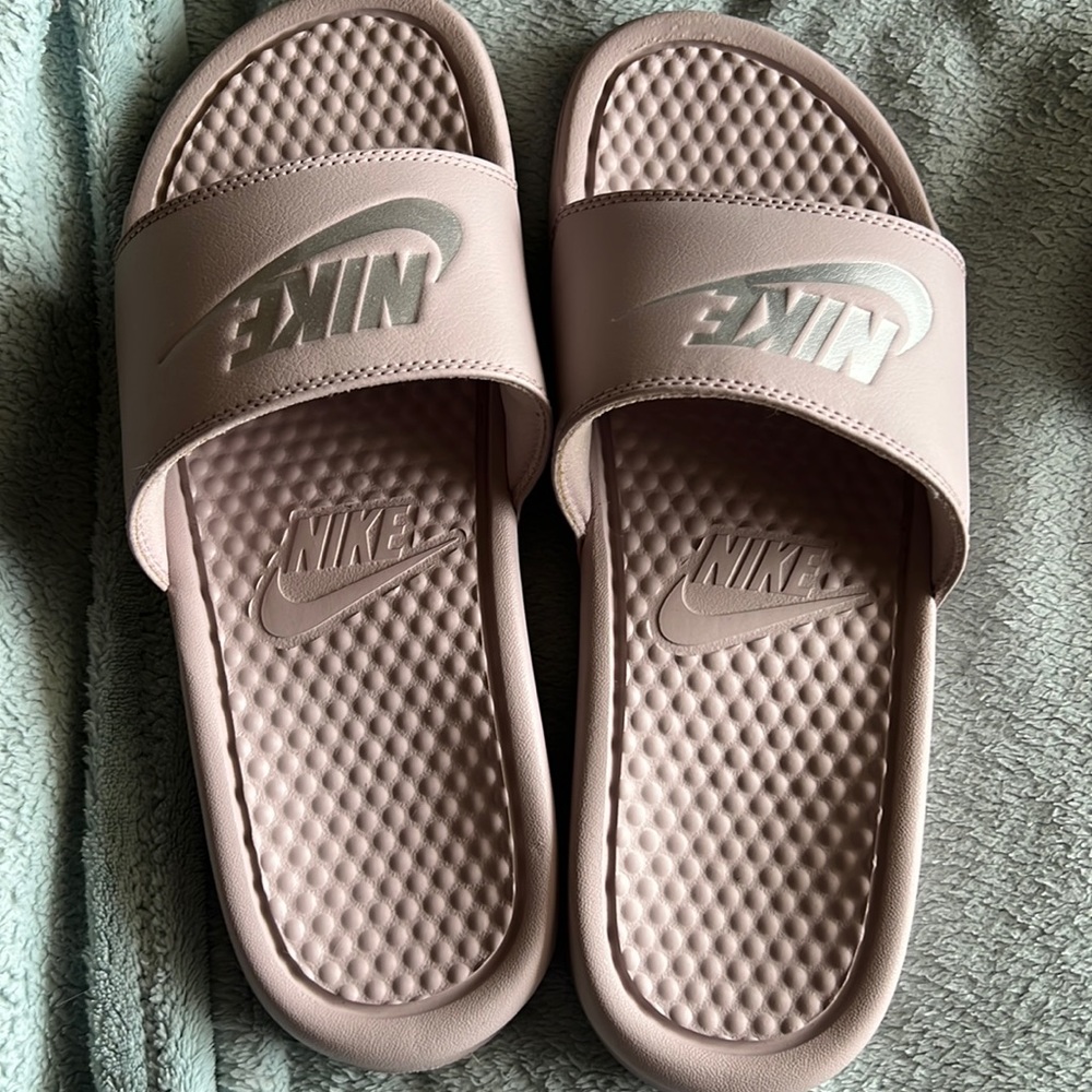 Nike slides, only worn a couple times. Has wear on the soles